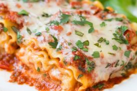 A close up of lasagna roll ups on a plate