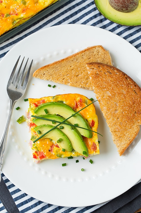 square of denver omelet on white plate with fork and toast