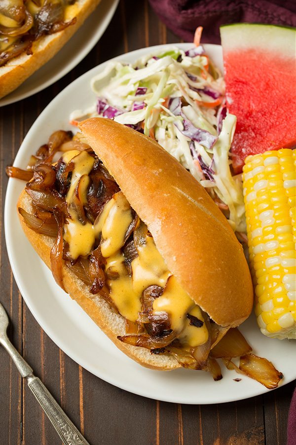 Brats with Caramelized Onions and Cheddar Cheese Sauce | Cooking Classy