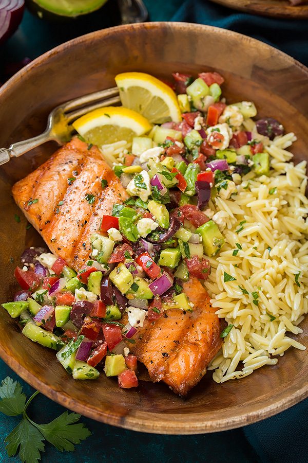 Grilled Salmon in a wooden single serving bowl with Avocado Greek Salsa and Orzo