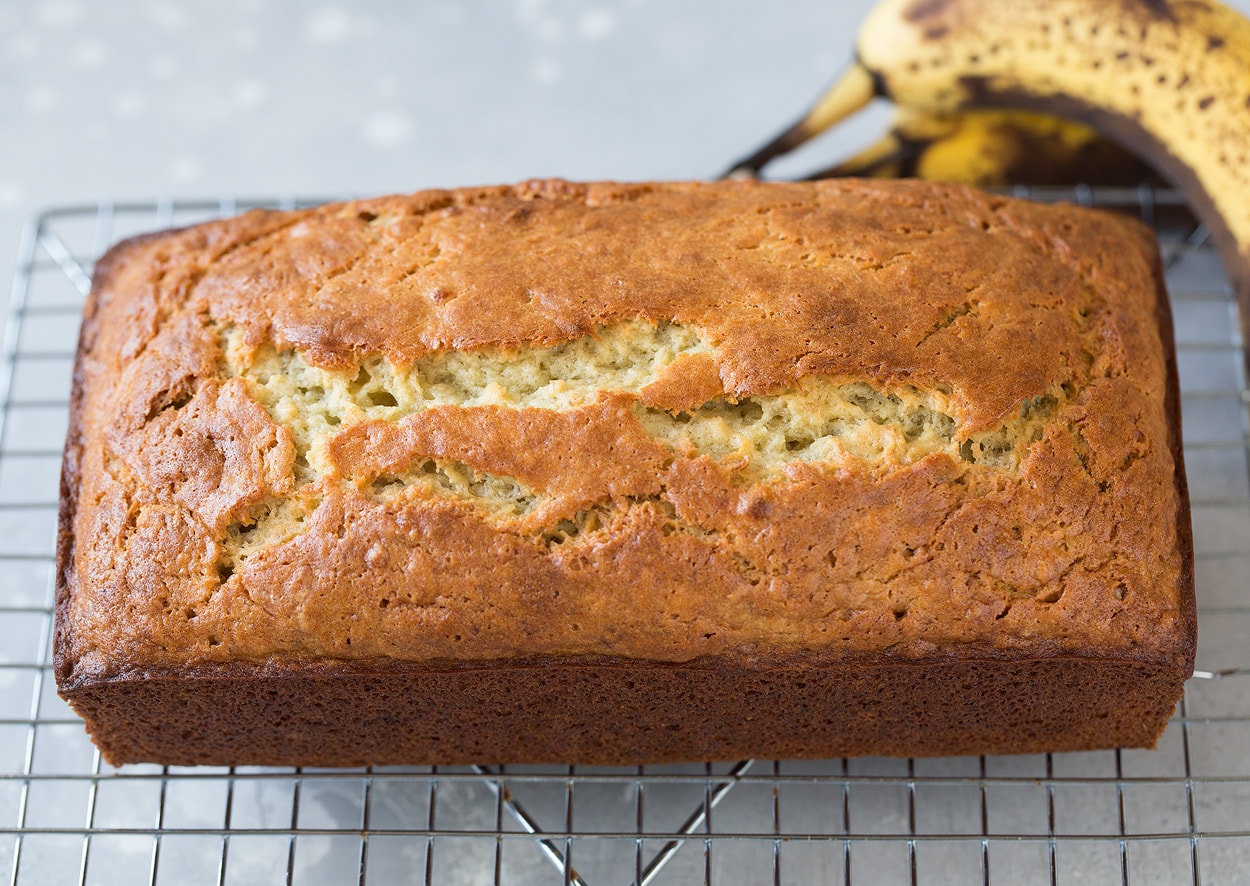 loaf of moist banana bread on cooling rack