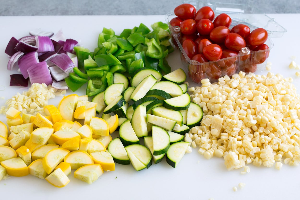 shrimp foil pack chopped veggies on cutting board