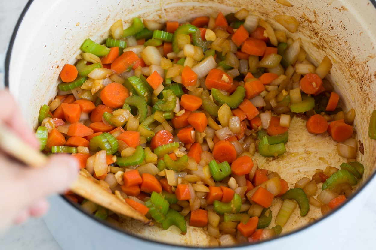Vegetable Beef Soup sauteing carrots onions celery and garlic in oil in pot