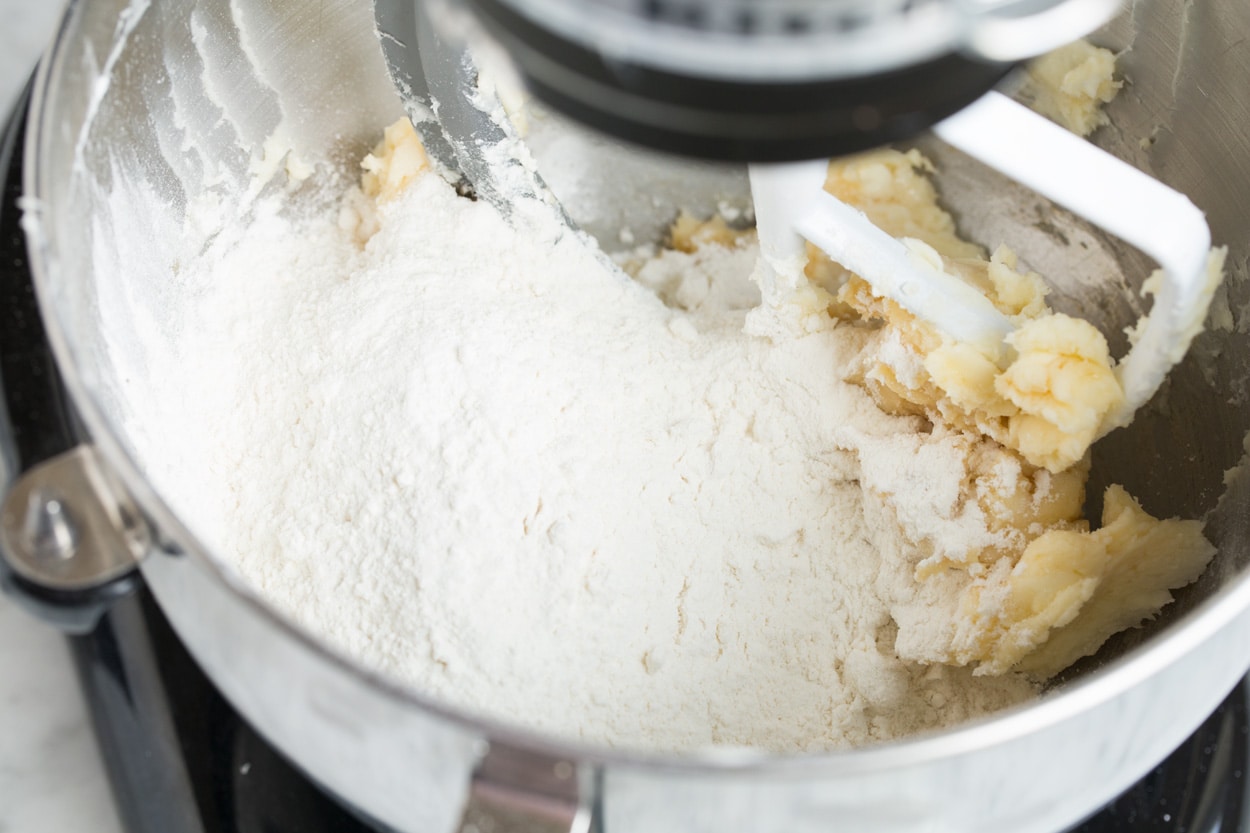 Mixing flour into Mexican Wedding Cookie dough.