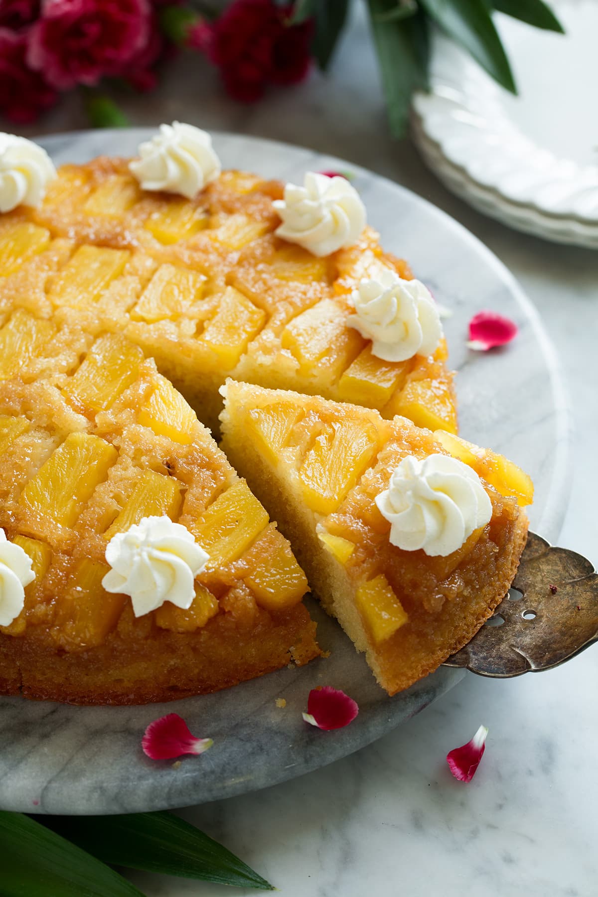 Cutting a slice of Pineapple Upside Down Cake