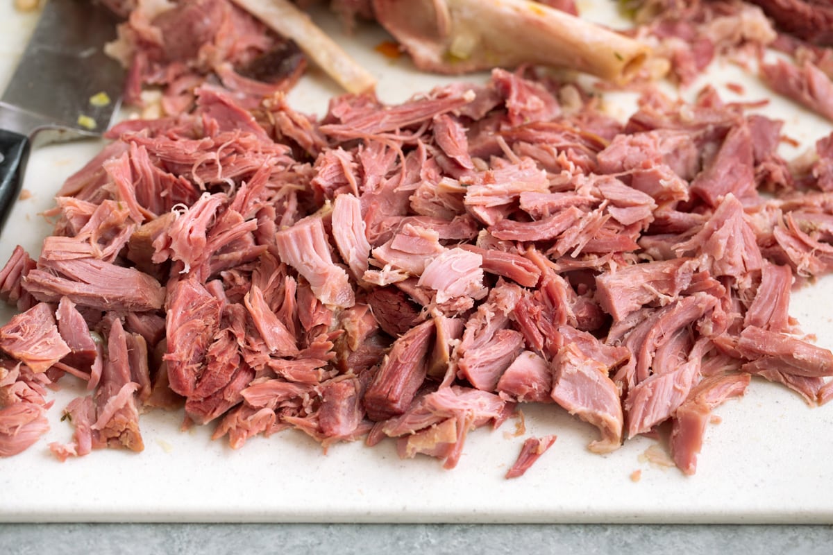 Shredded ham on a cutting board.