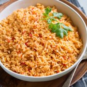 Bowl full of Mexican Rice garnished with cilantro.