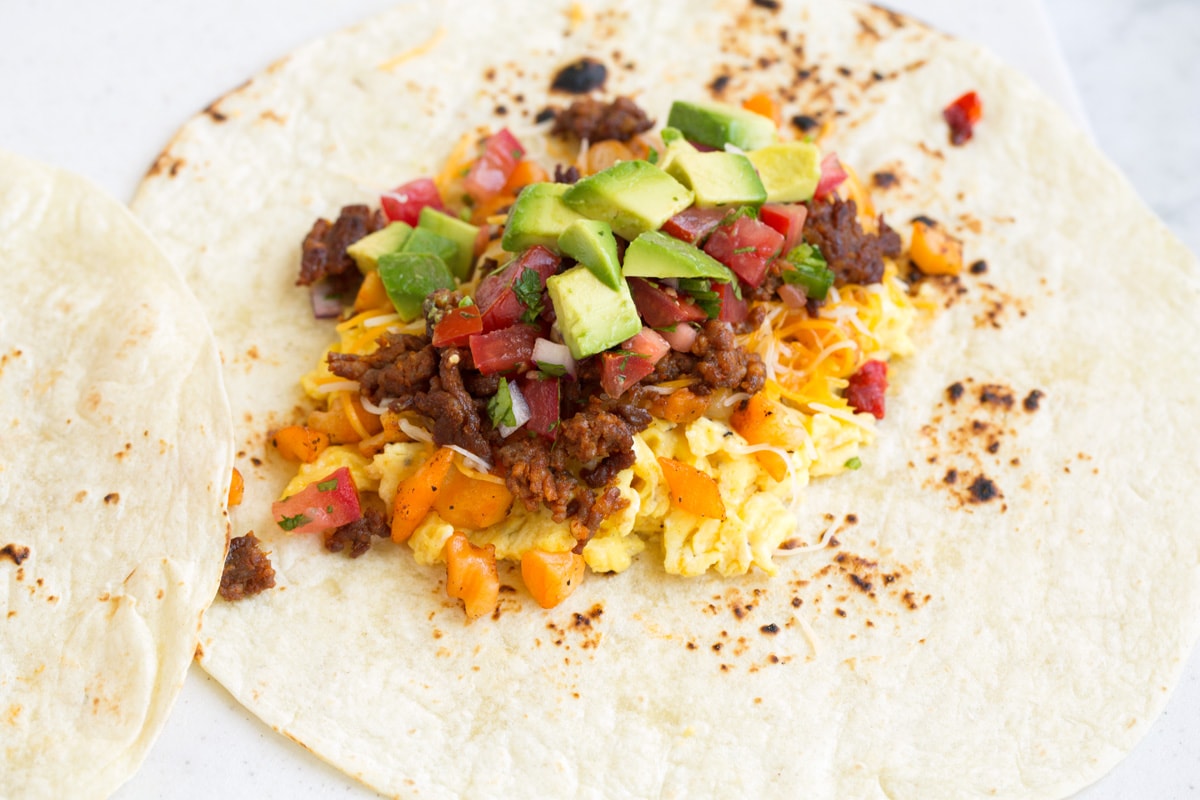 showing how to assemble breakfast burritos