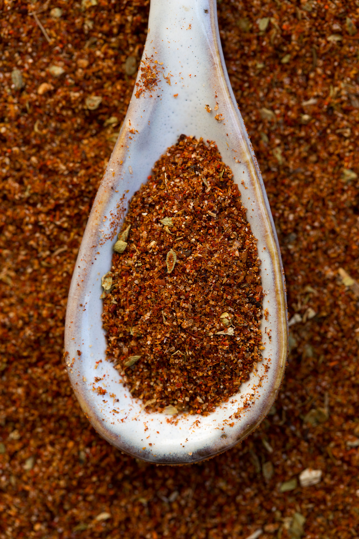 Close up image of taco seasoning in a teaspoon.