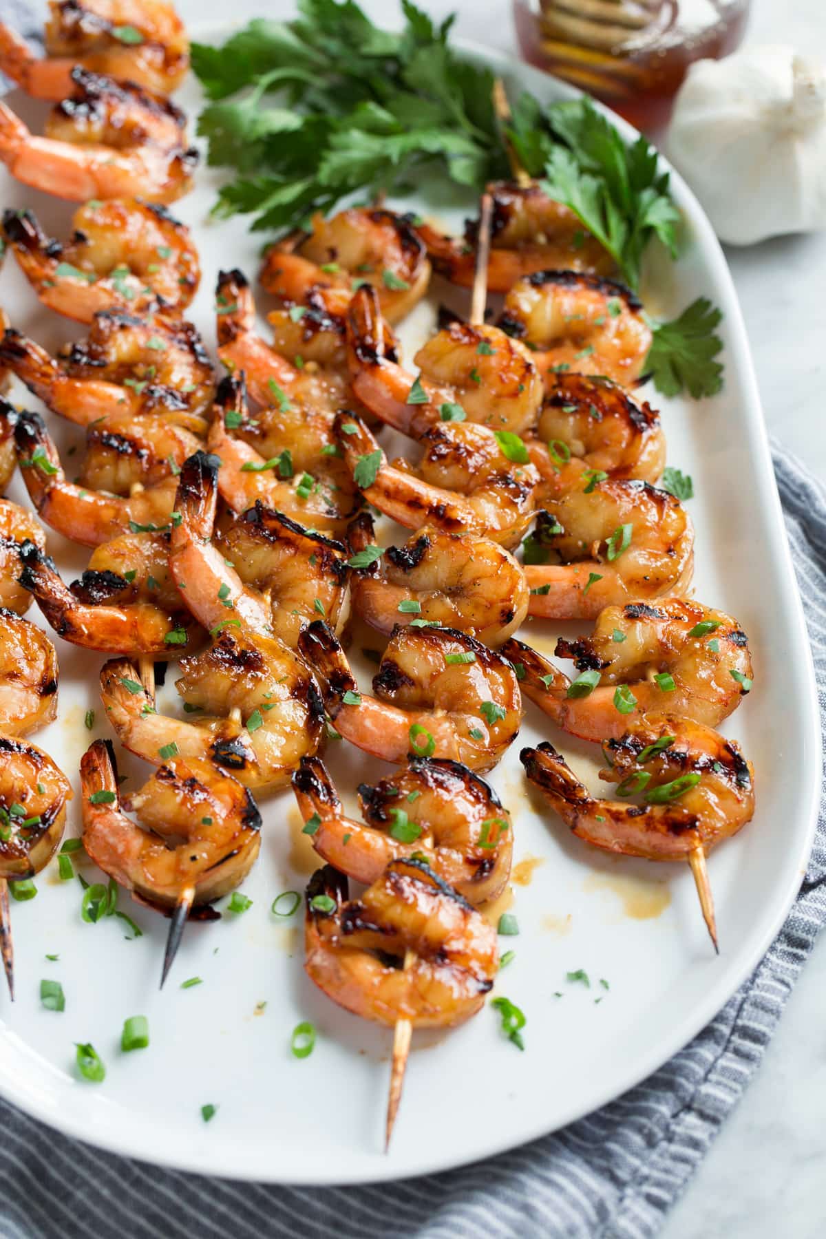 Platter with grilled shrimp on skewers