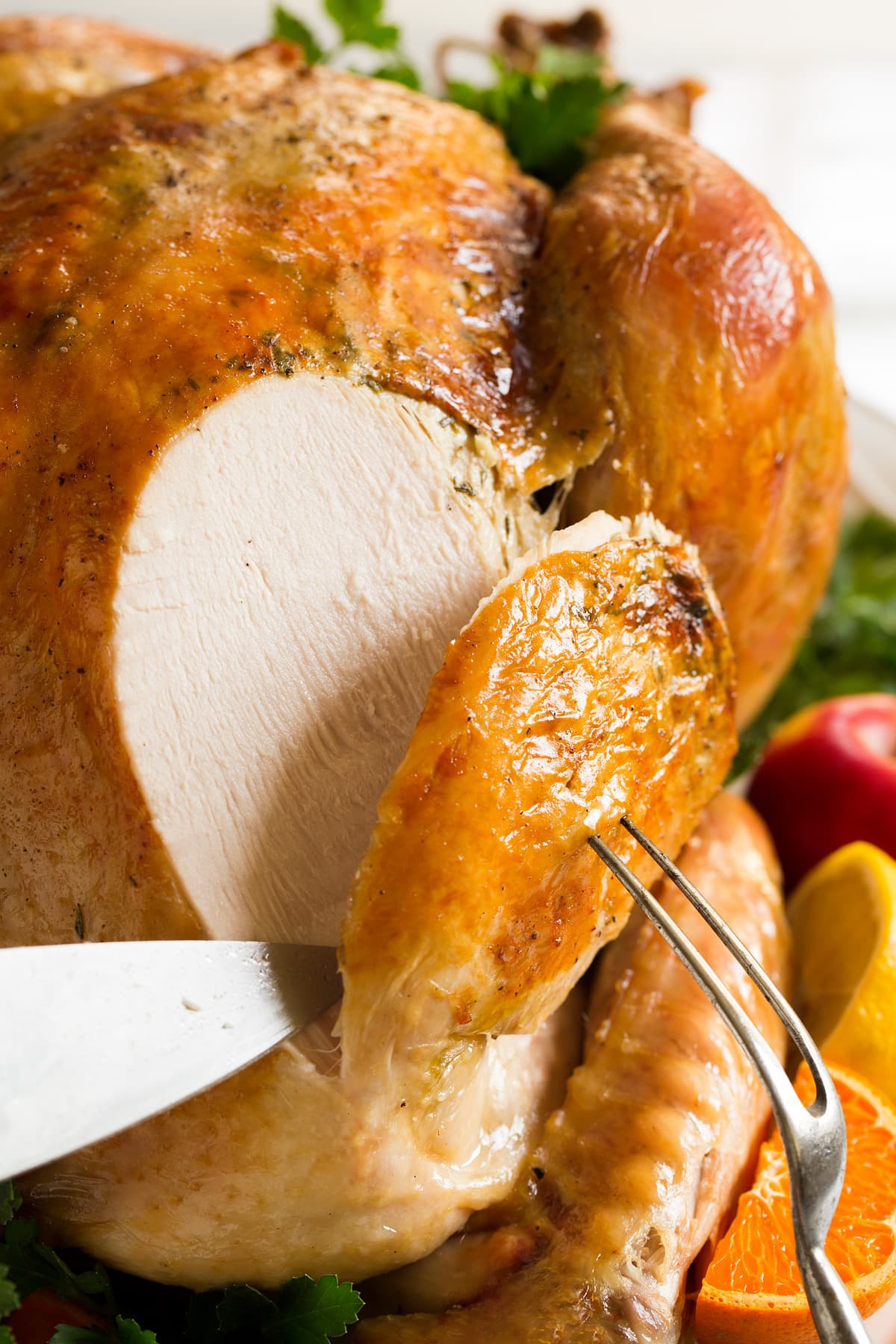 Slicing into a whole turkey.