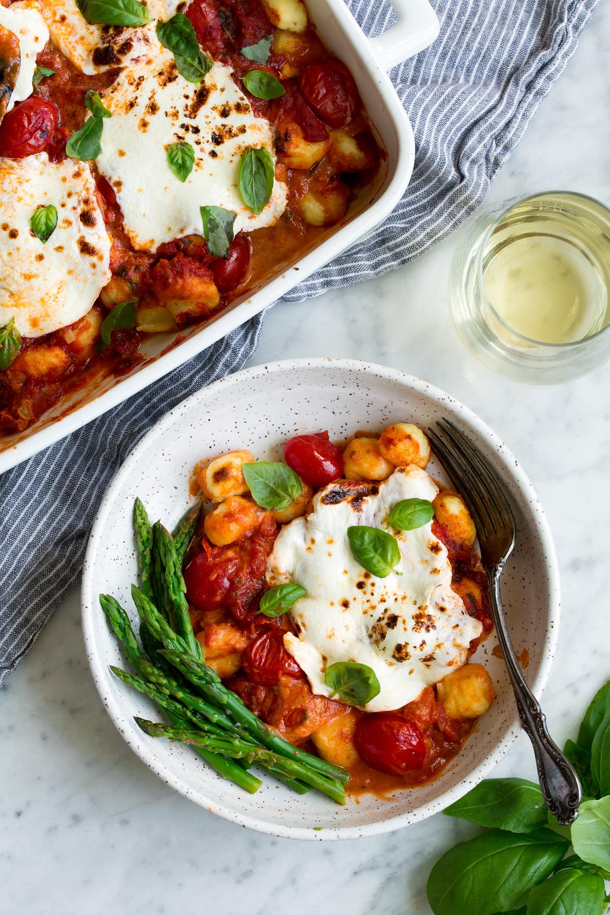 Serving of baked gnocchi in a pasta bowl.