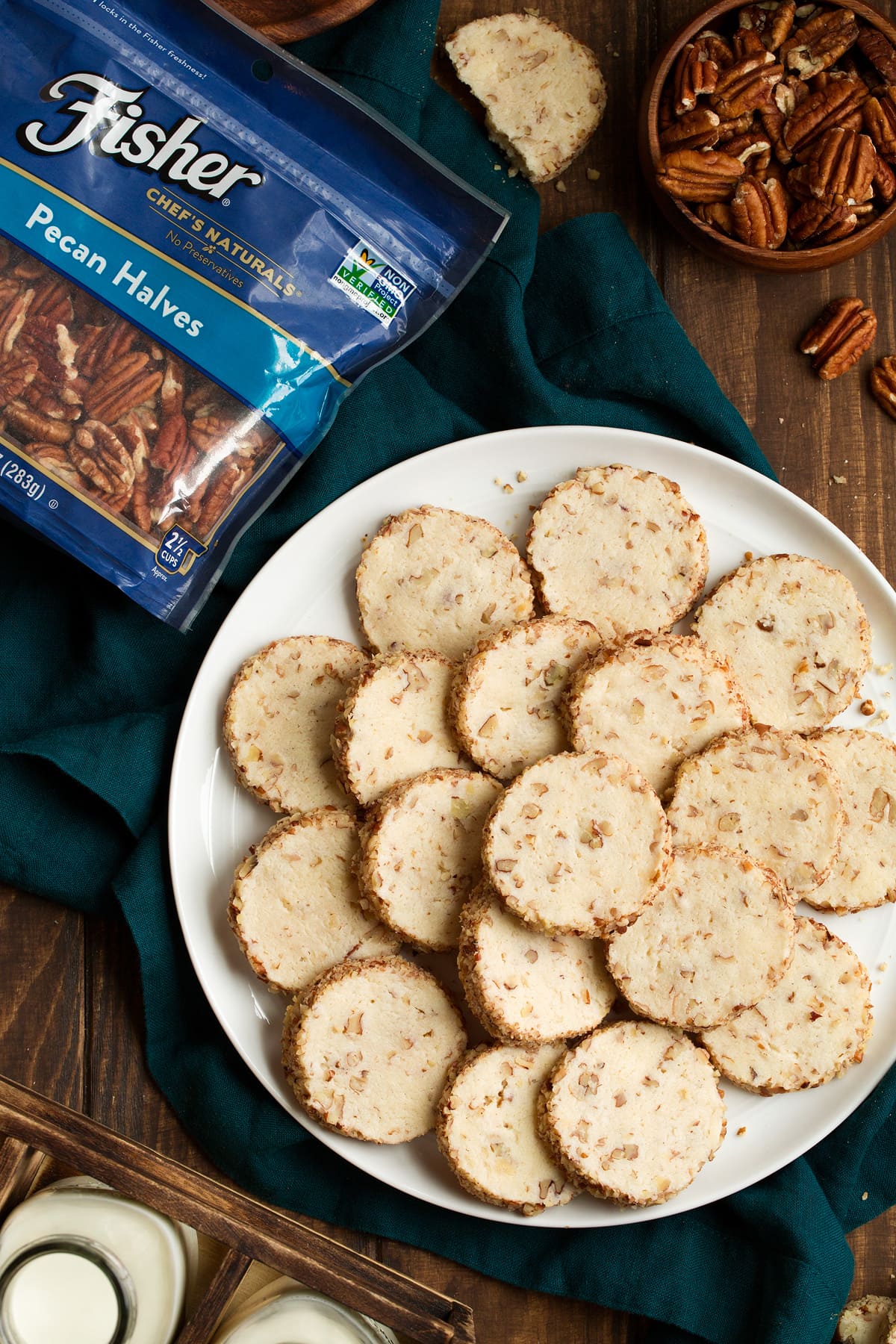 Cream Cheese Pecan Cookies stacked on a serving plate.