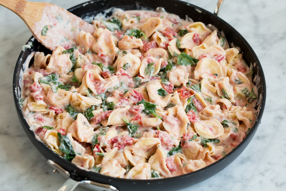 Finished tortellini recipe in a skillet.