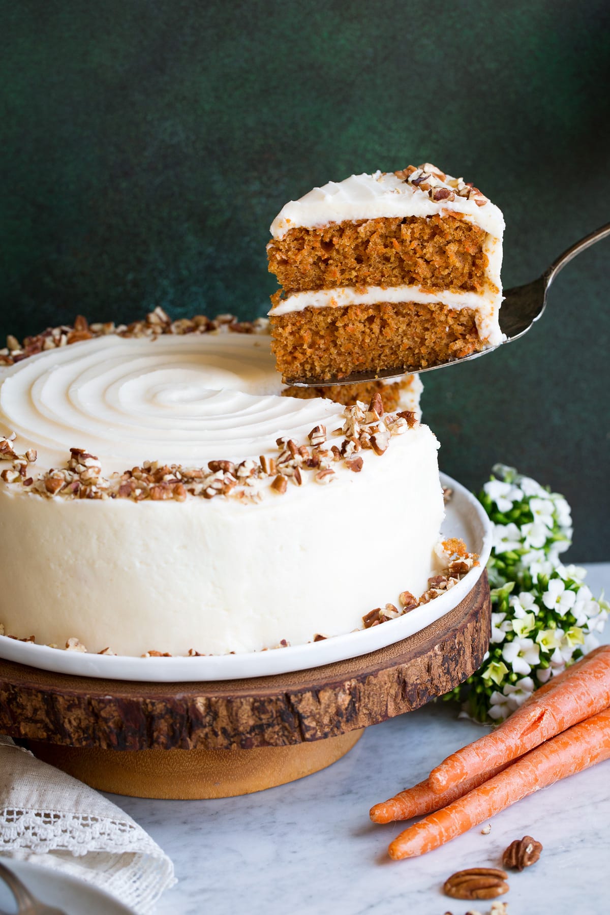 Carrot Cake with one slice being removed.