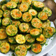 Baked zucchini shown sliced, from a side angle.