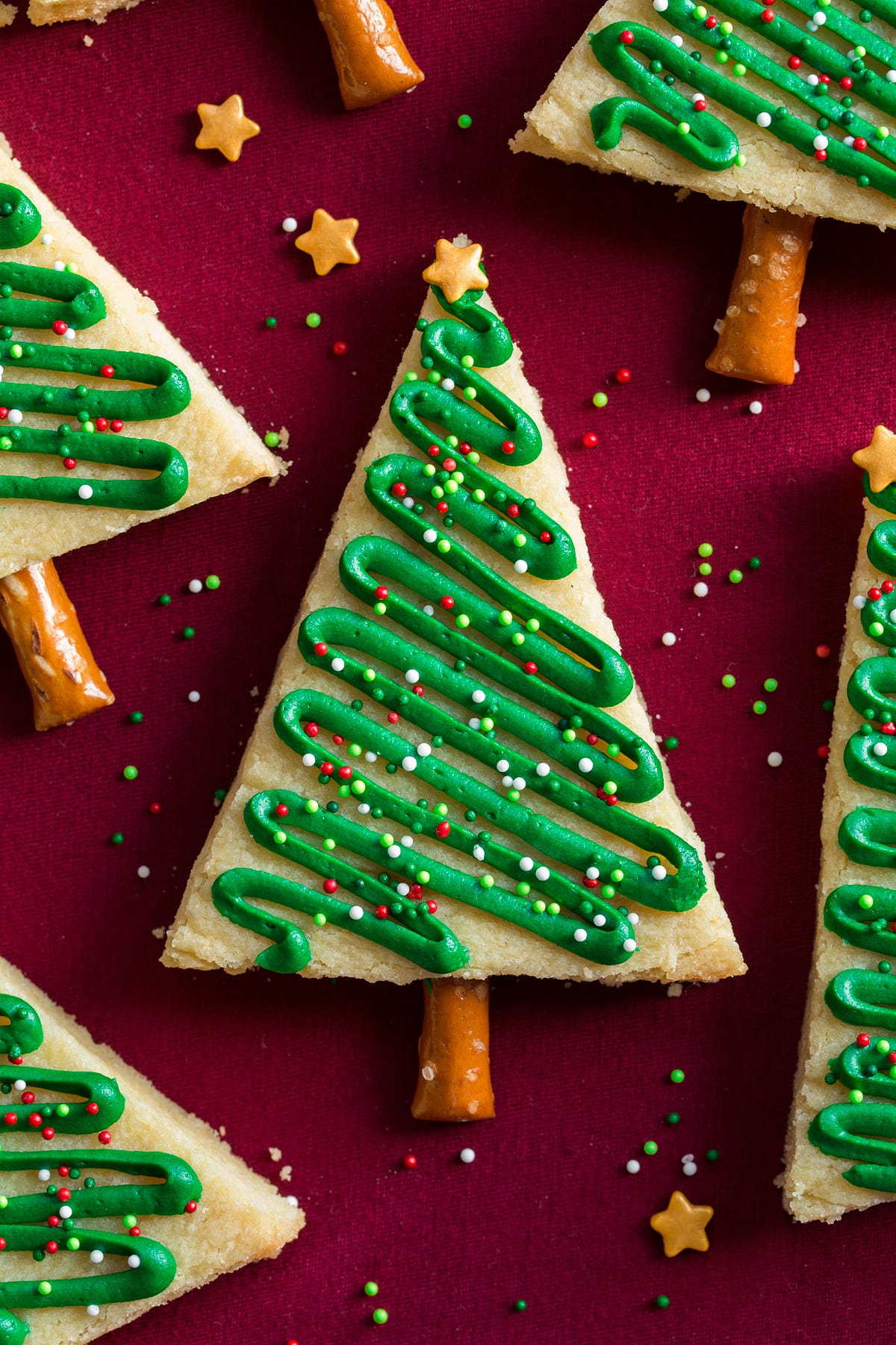Close up overhead image of a frosted Christmas tree sugar cookie.