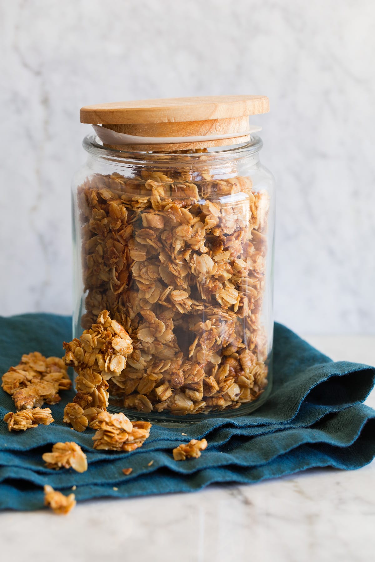 Honey granola shown in a glass jar.