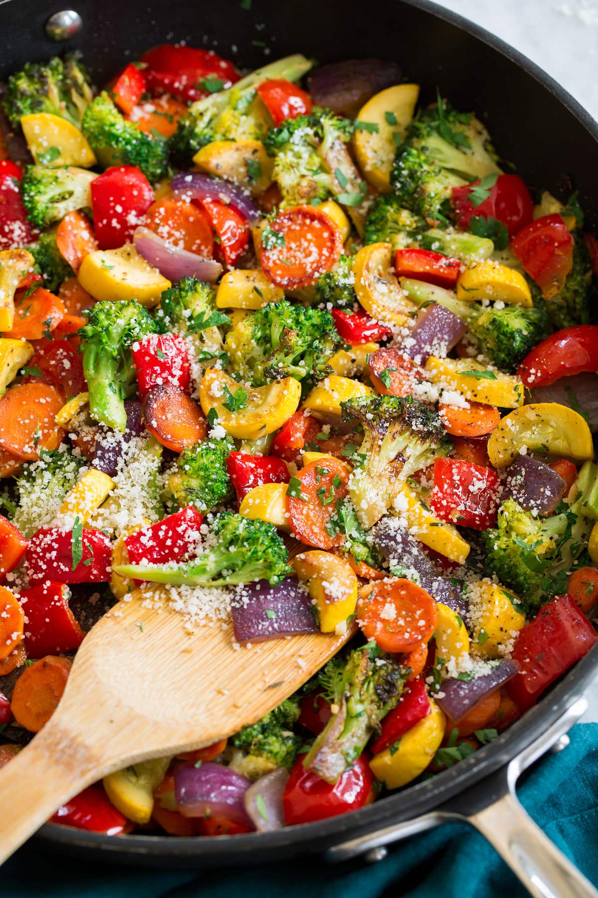 Photo: Sauteed vegetables garnished with parsley and parmesan cheese.