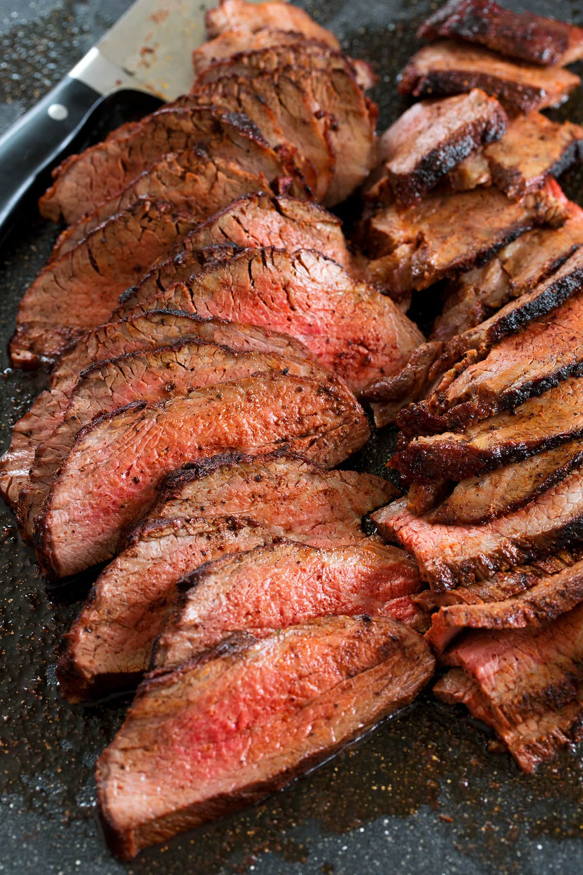 Close up photo of thinly sliced roasted tri tip.