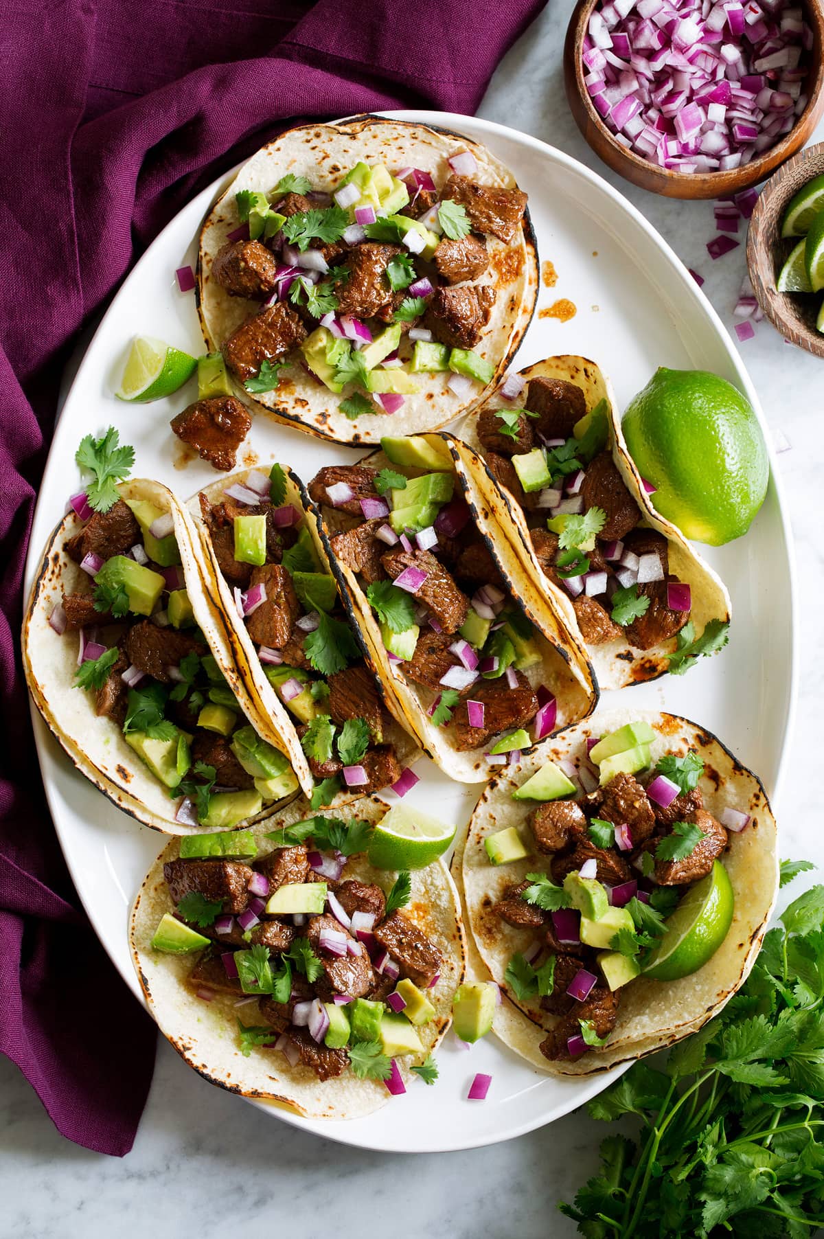 Overhead photo of platter with steak tacos.