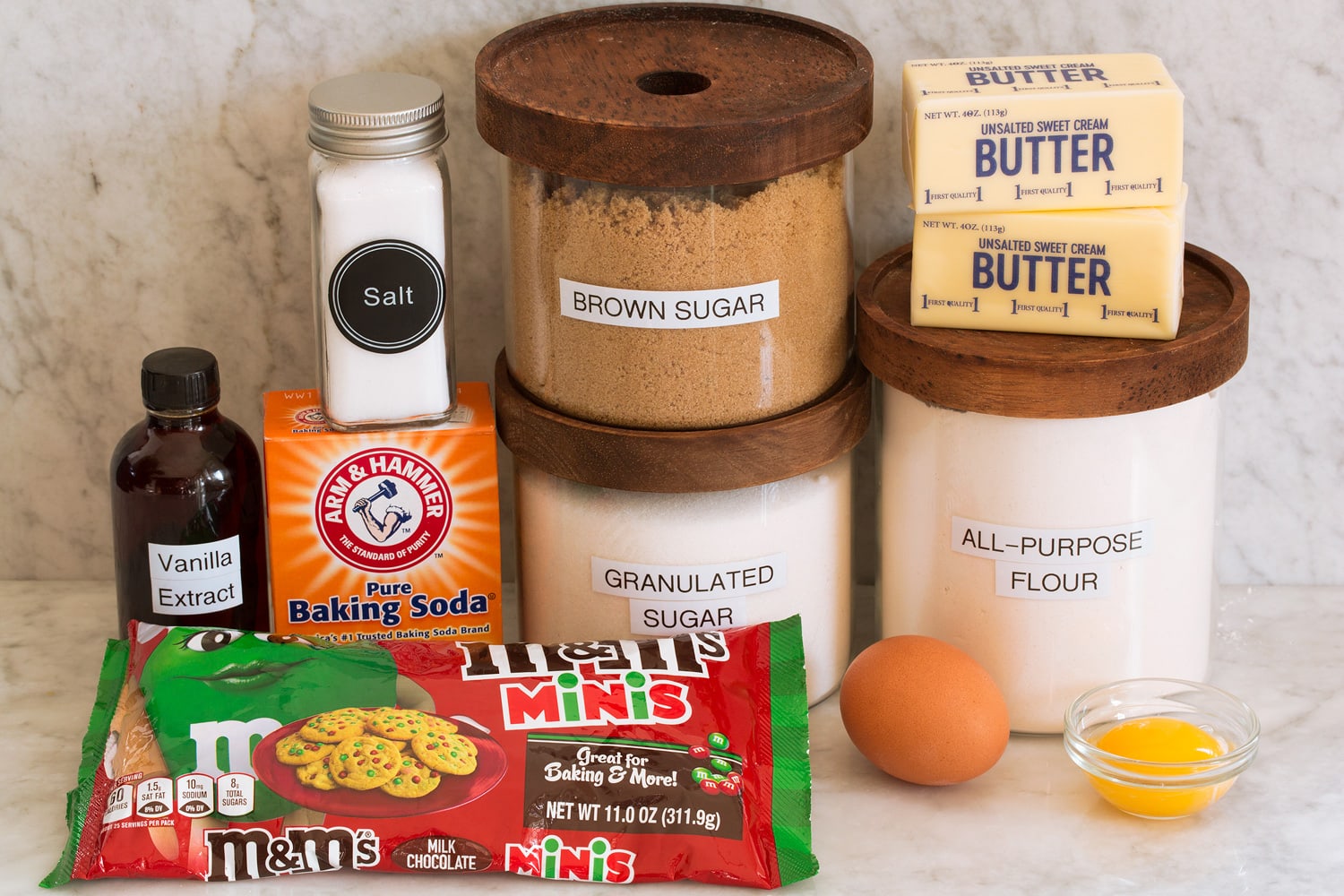 Ingredients needed to make M&M cookies from scratch.