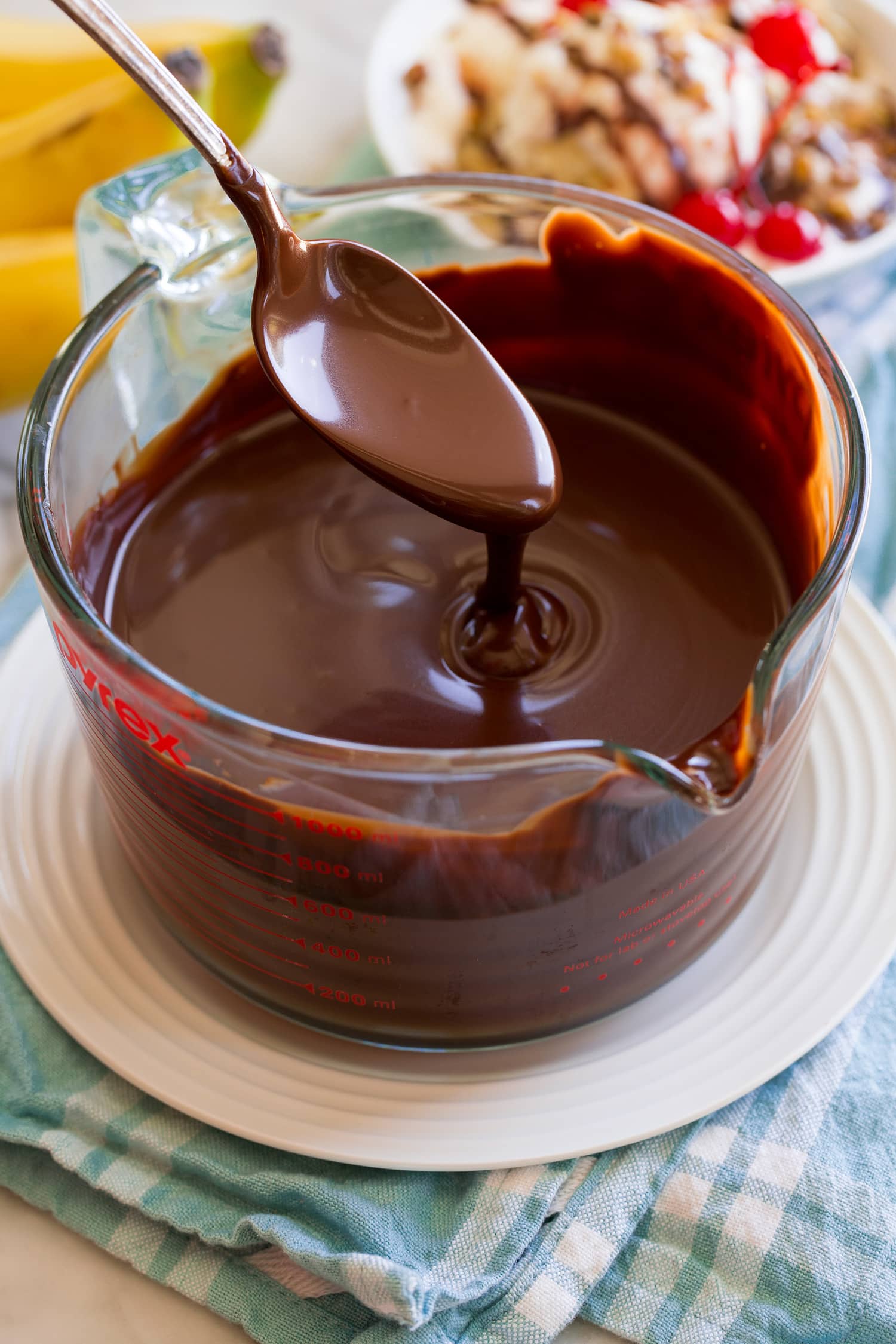 Spoonful of chocolate fudge sauce.