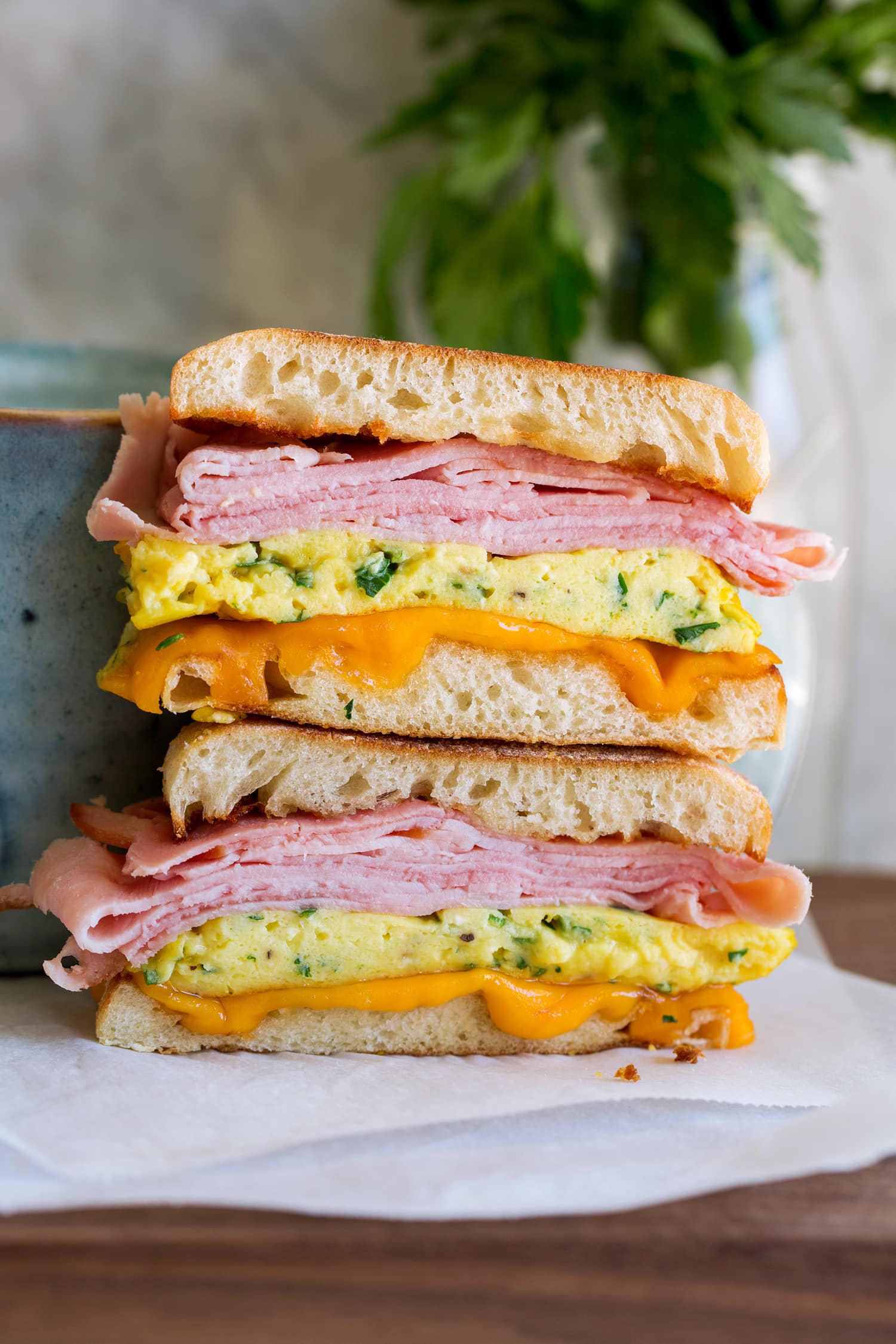 Breakfast sandwiches sliced in half.