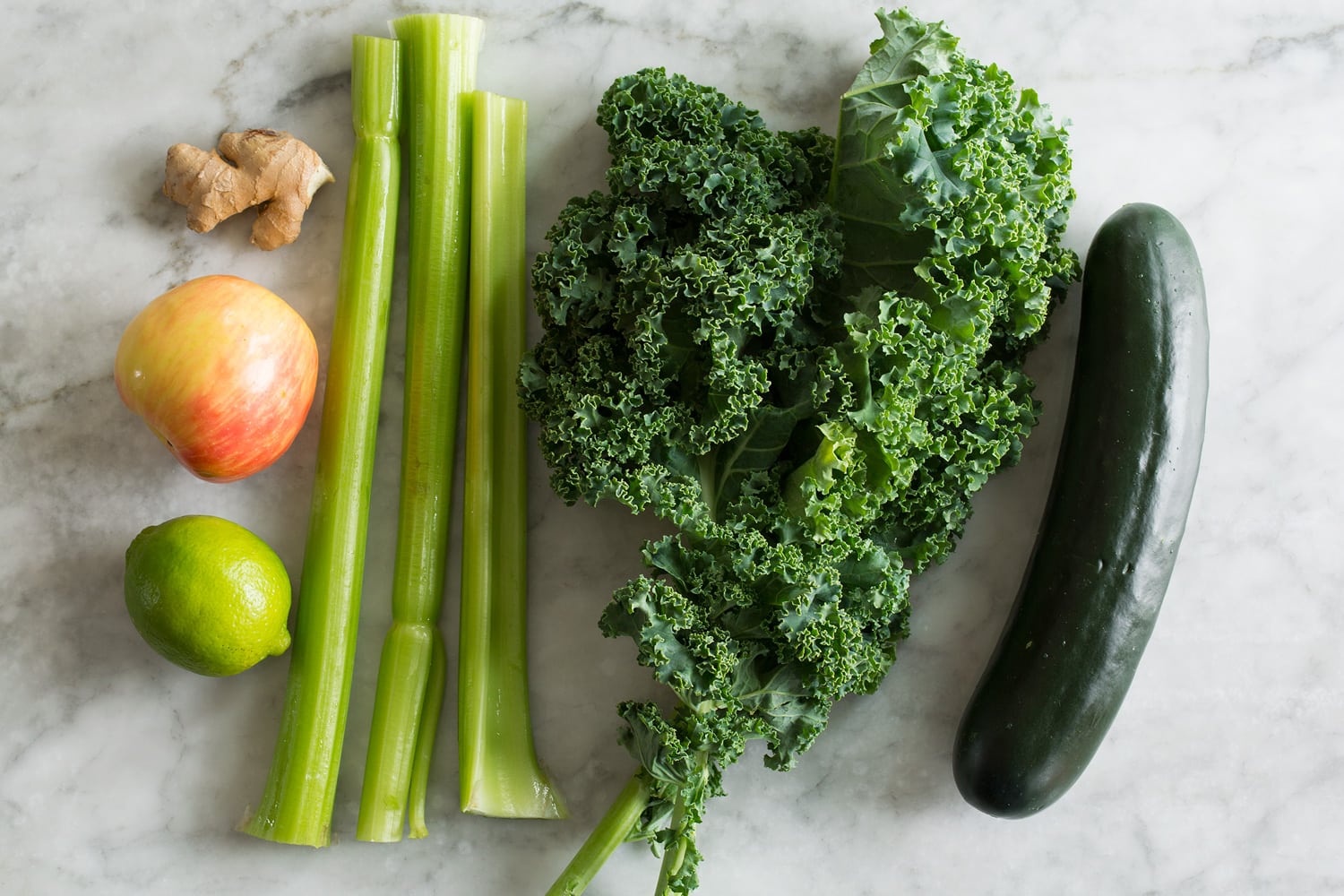 Ingredients needed to make a green juice recipe.