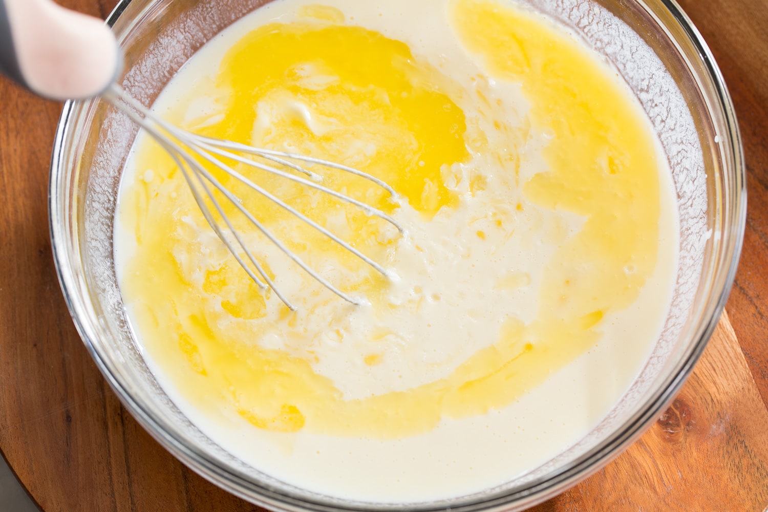 Adding butter to wet mixture.