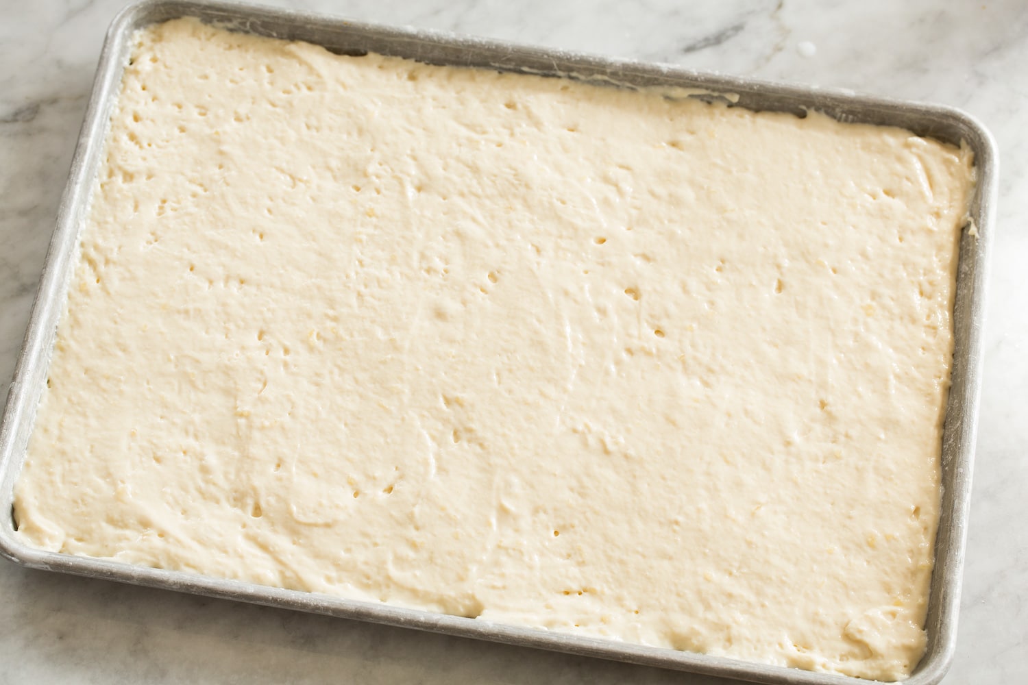 Pancake mix poured into baking sheet.