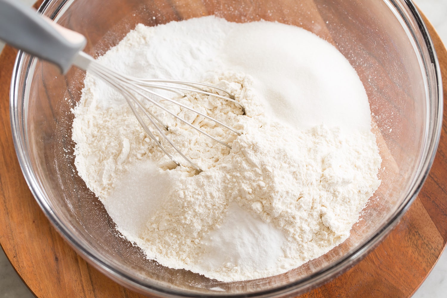 Mixing dry ingredients for pancake mix.