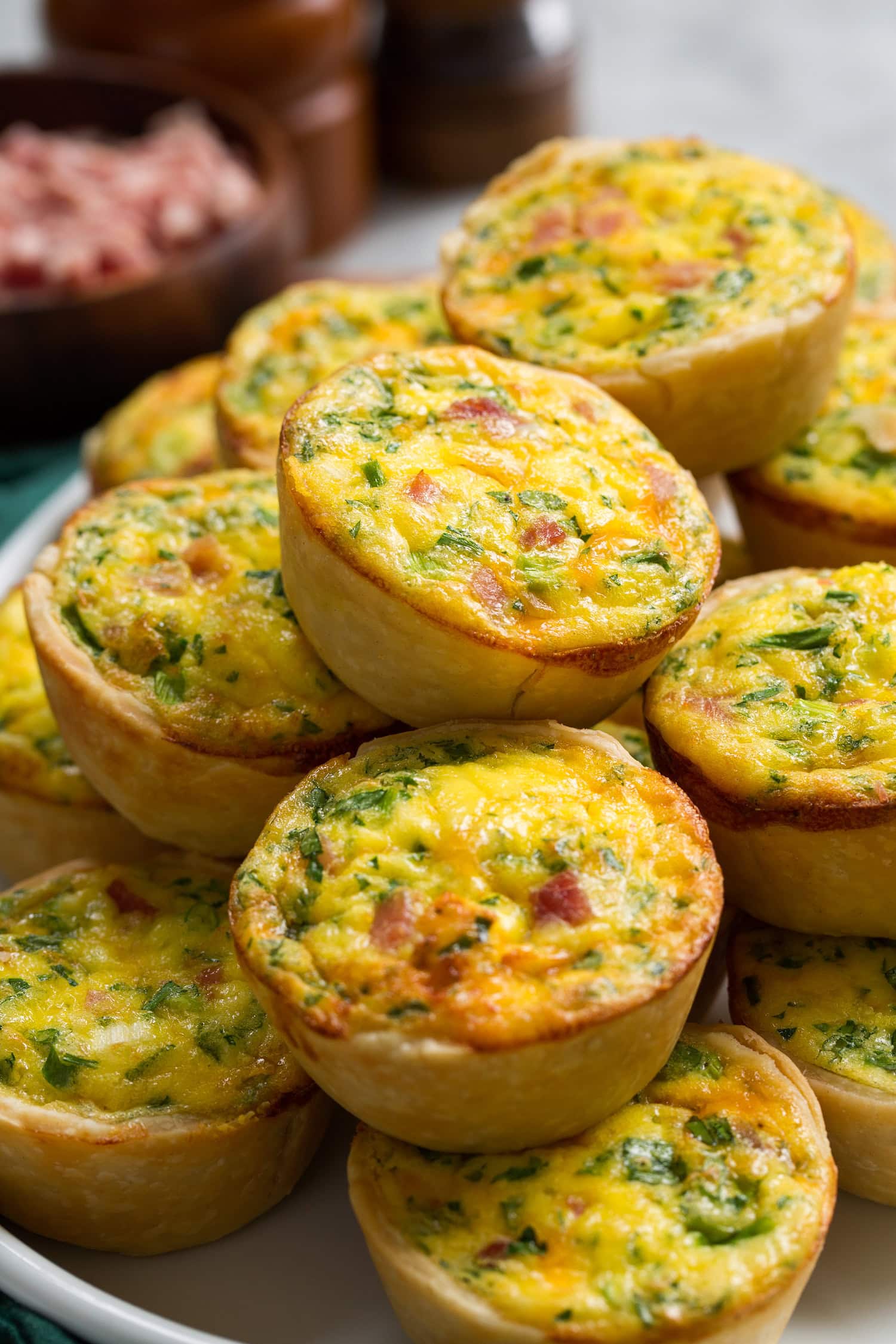 Close up image of mini quiche with pie crust.