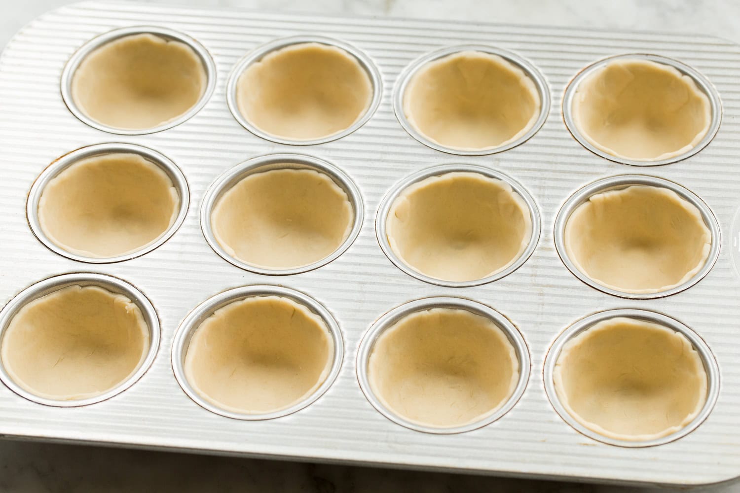 Pie crusts in muffin tin.