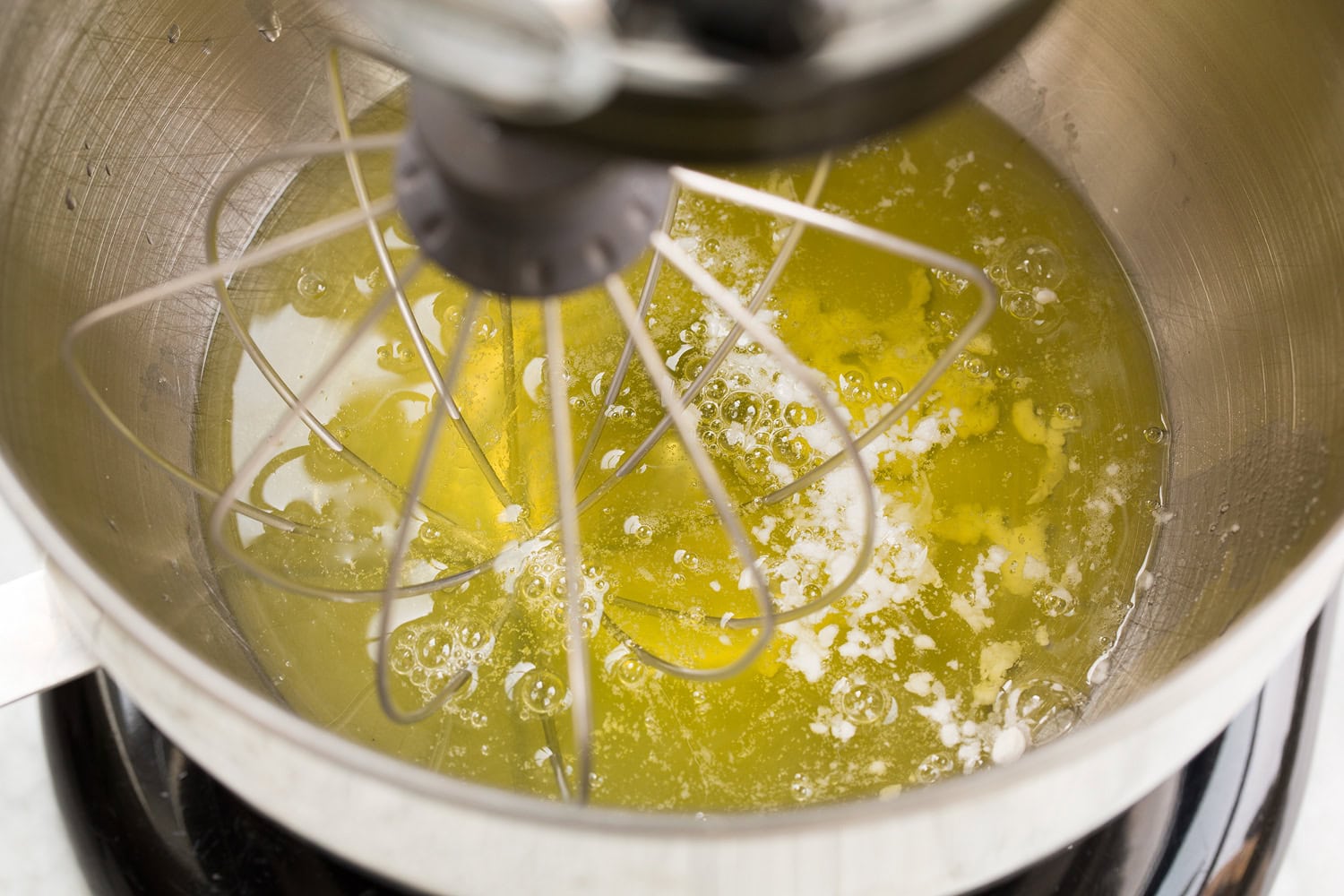 Egg whites and cream of tartar in stand mixer.