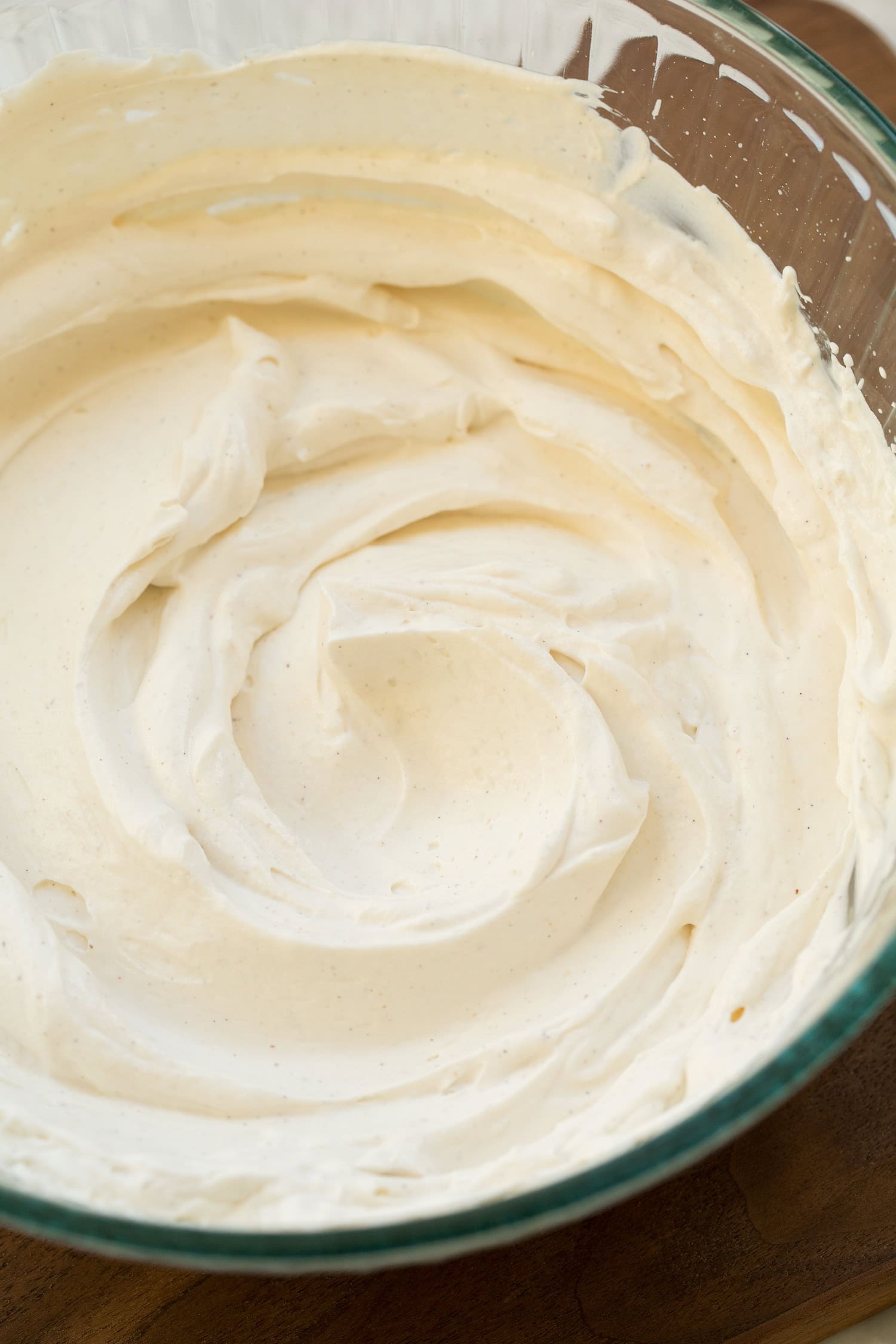 Completed fluffy whipped Greek yogurt in glass mixing bowl.