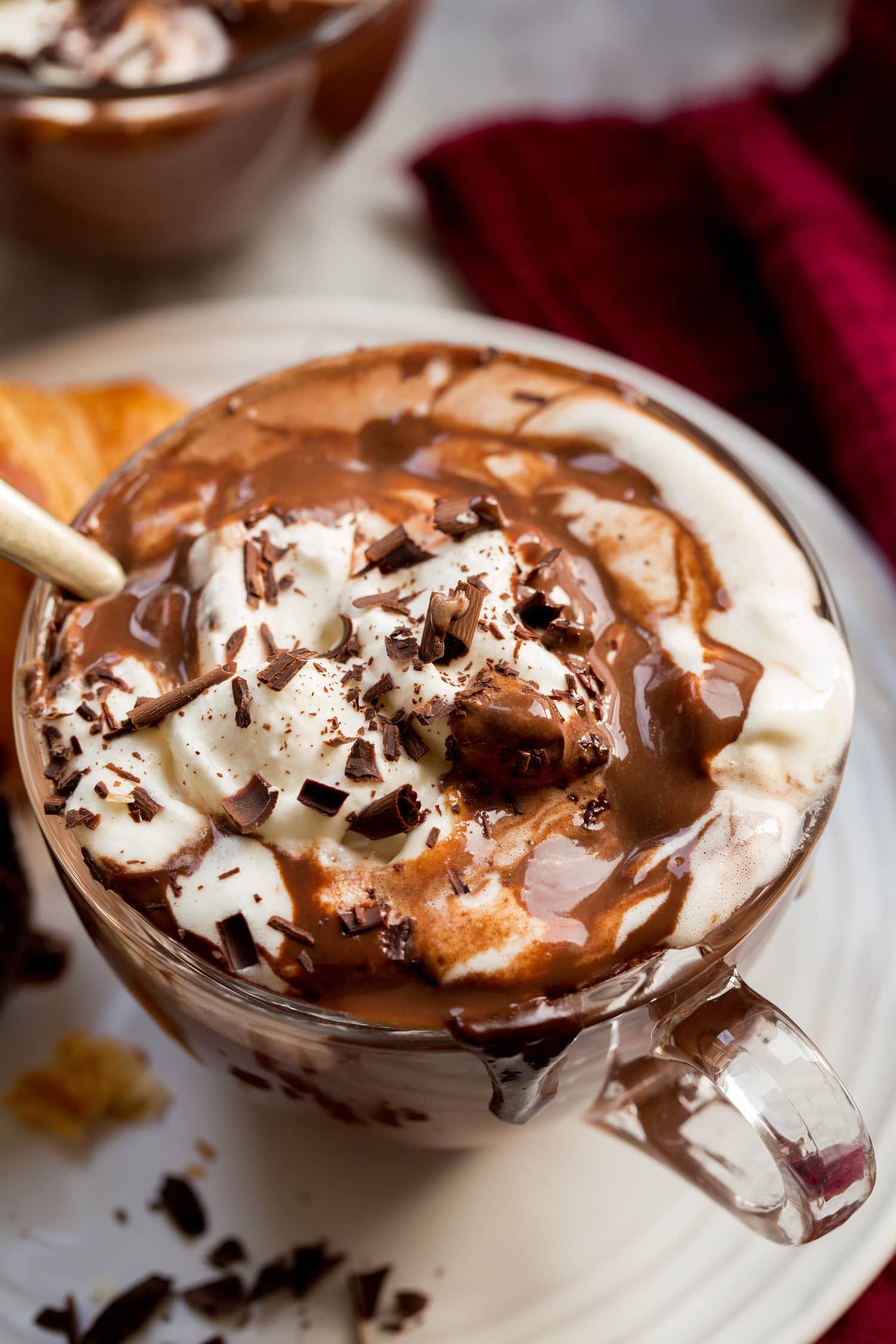 Close up photo of thick French hot chocolate with whipped cream.