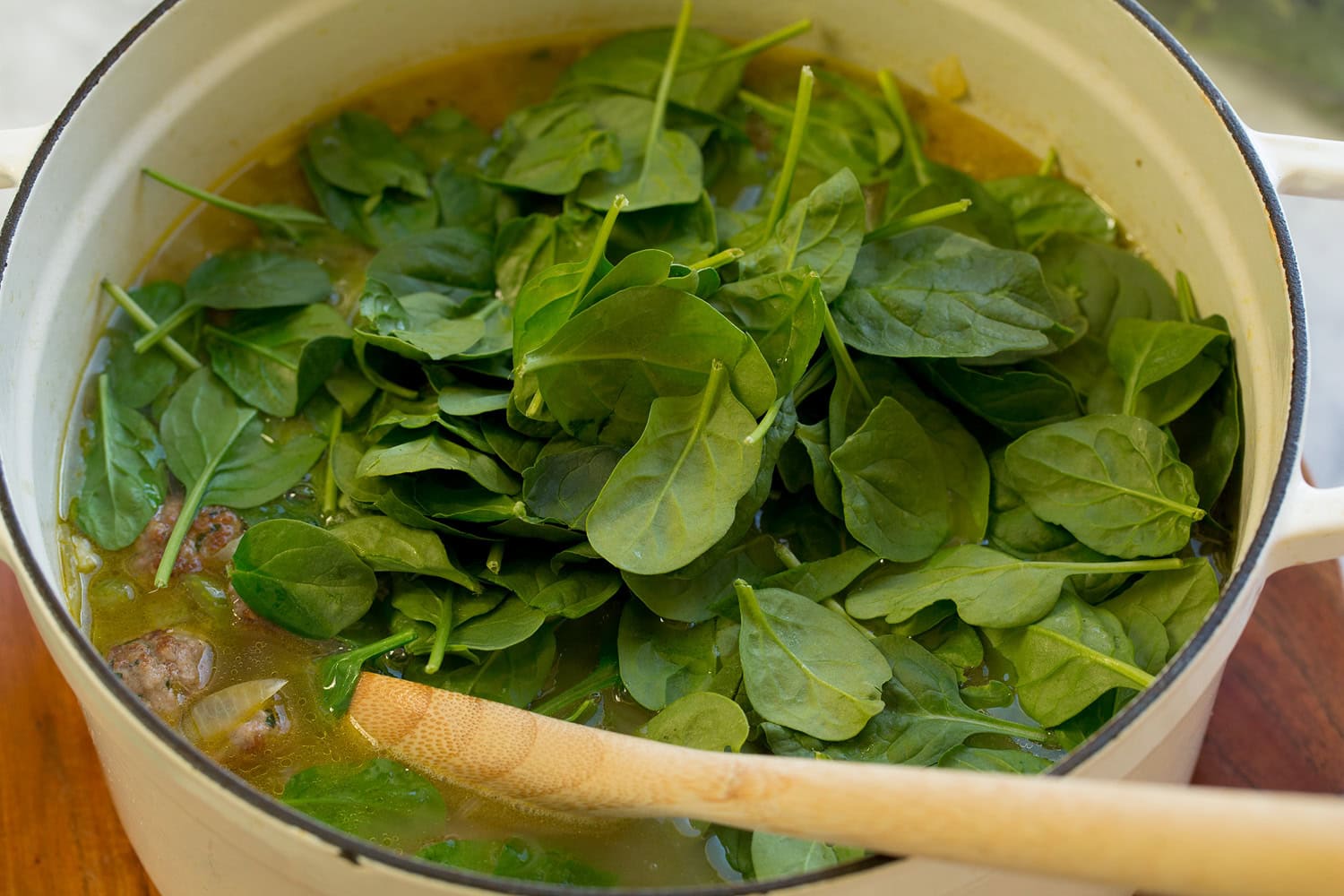 Spinach added to soup.