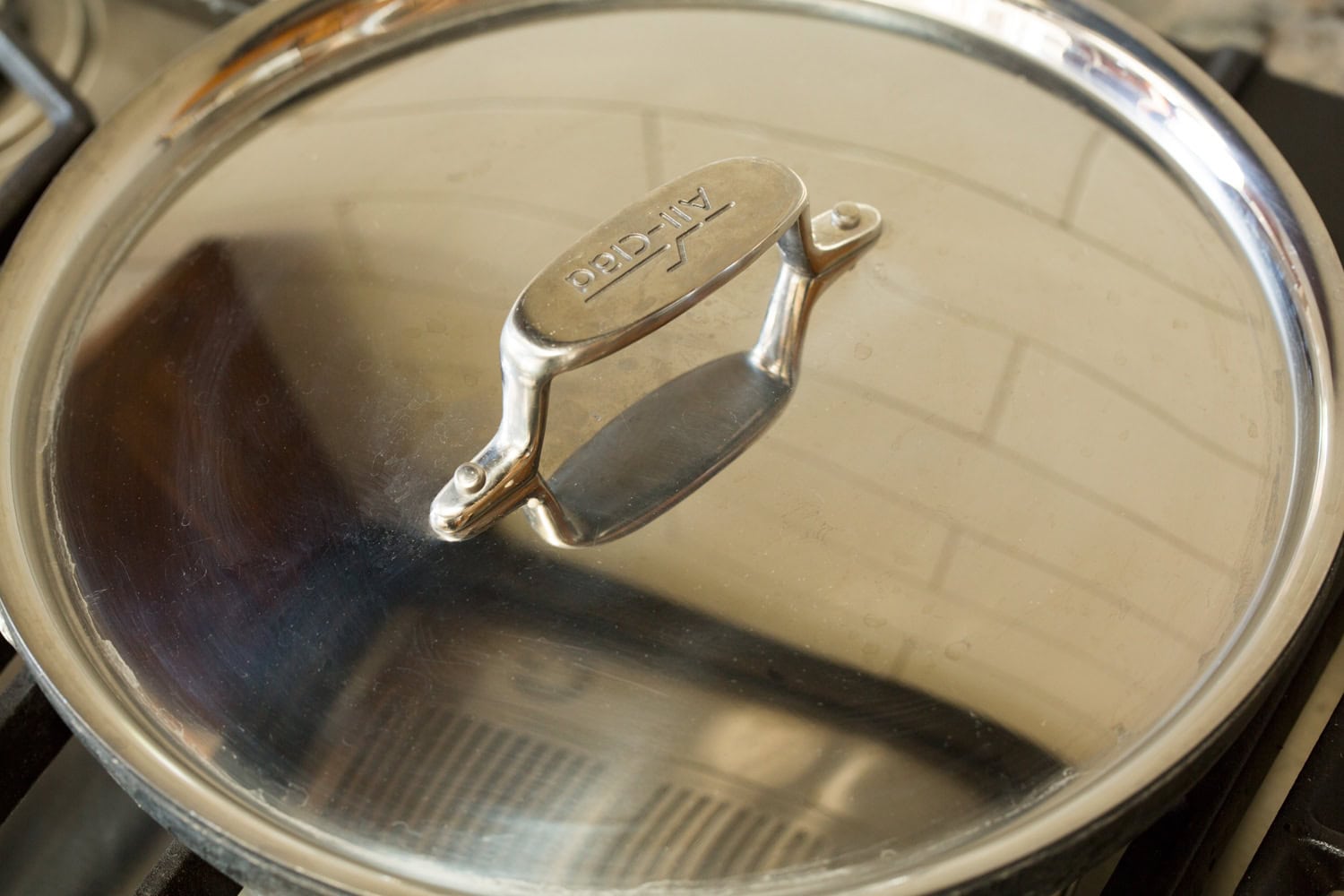 Lid over skillet to cook egg white omelette.
