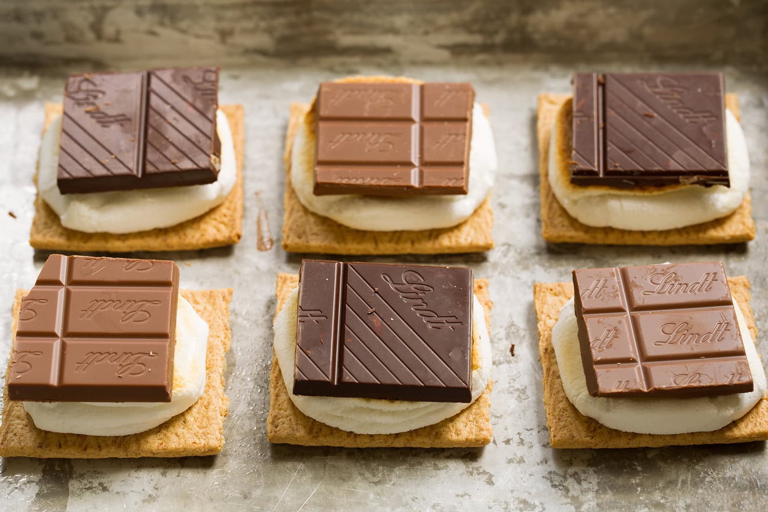 Chocolate square layered over toasted marshmallows.
