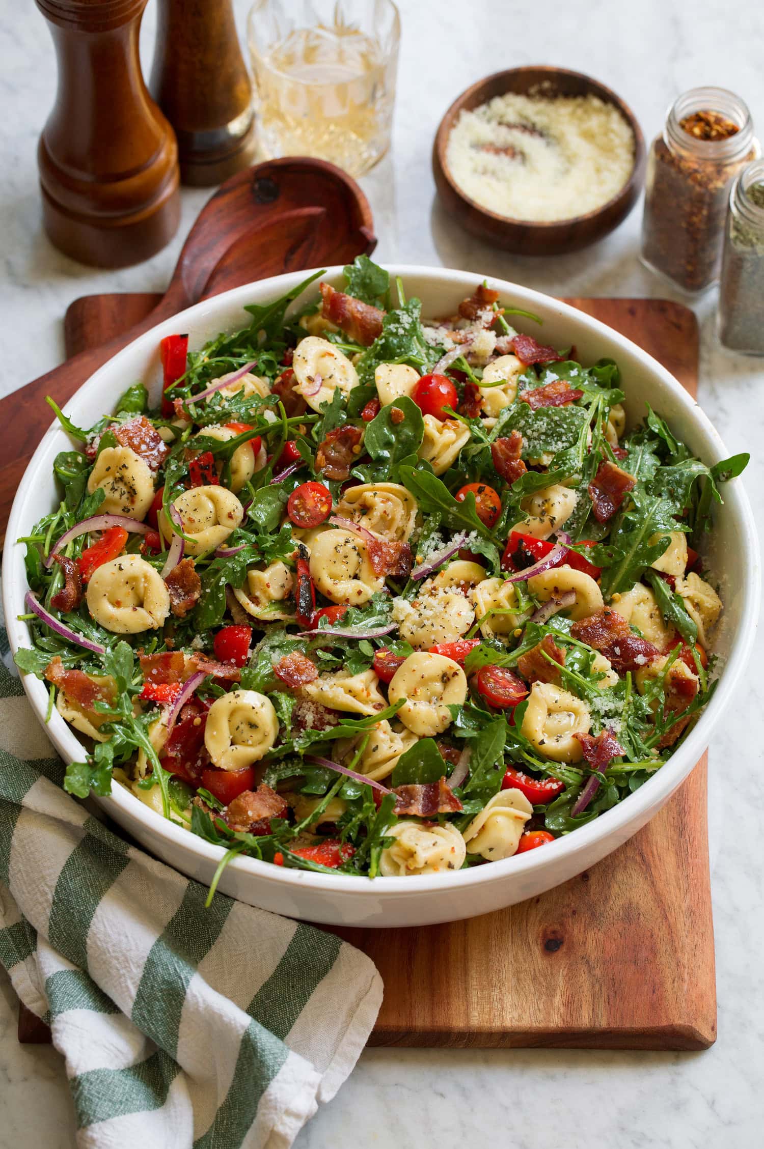 Tortellini pasta salad with four cheese tortellini, arugula, bacon, tomatoes and bell peppers.