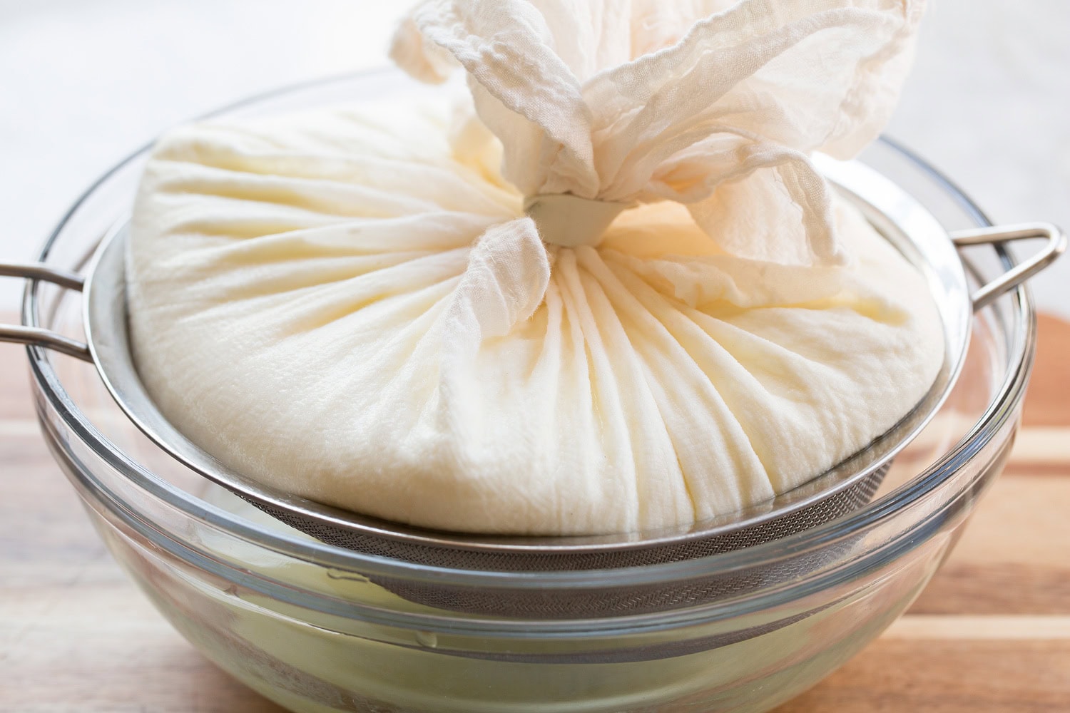 Yogurt straining through cheesecloth.